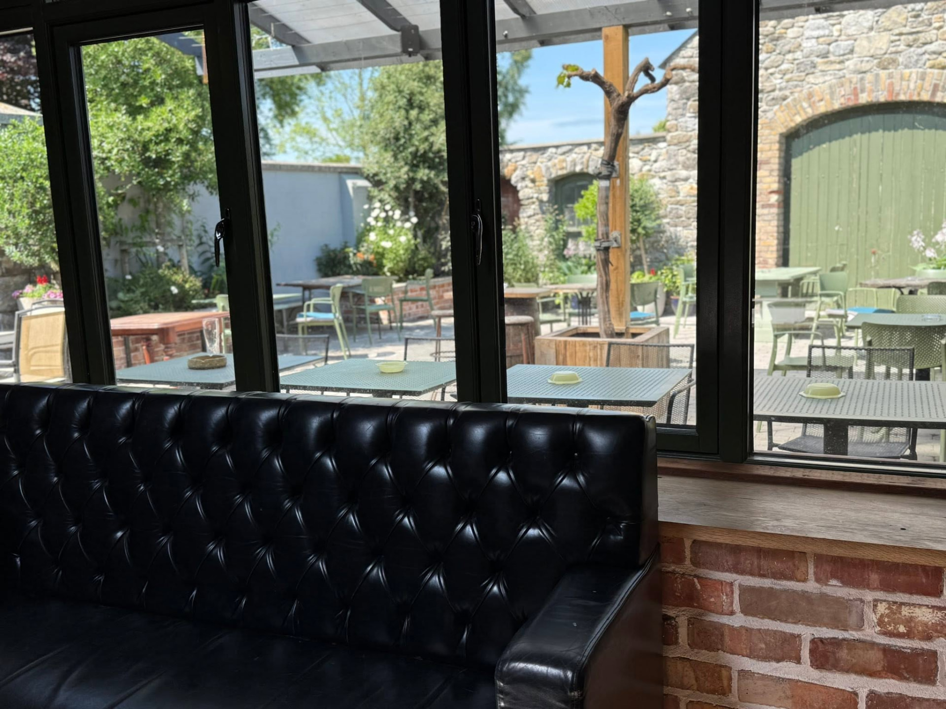Leather banquette looking out to the courtyard