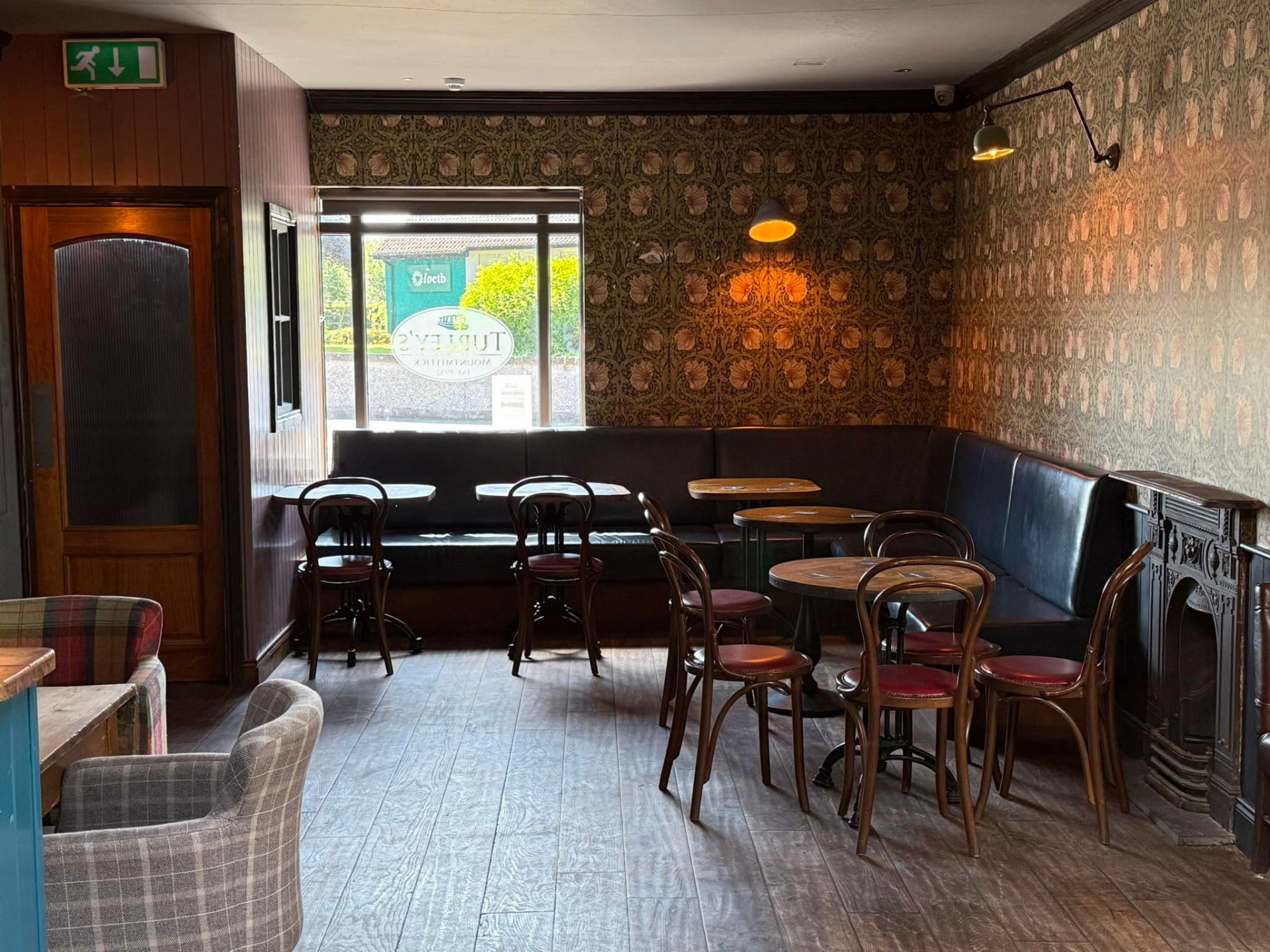 The lounge with its patterned walls and leather banquettes