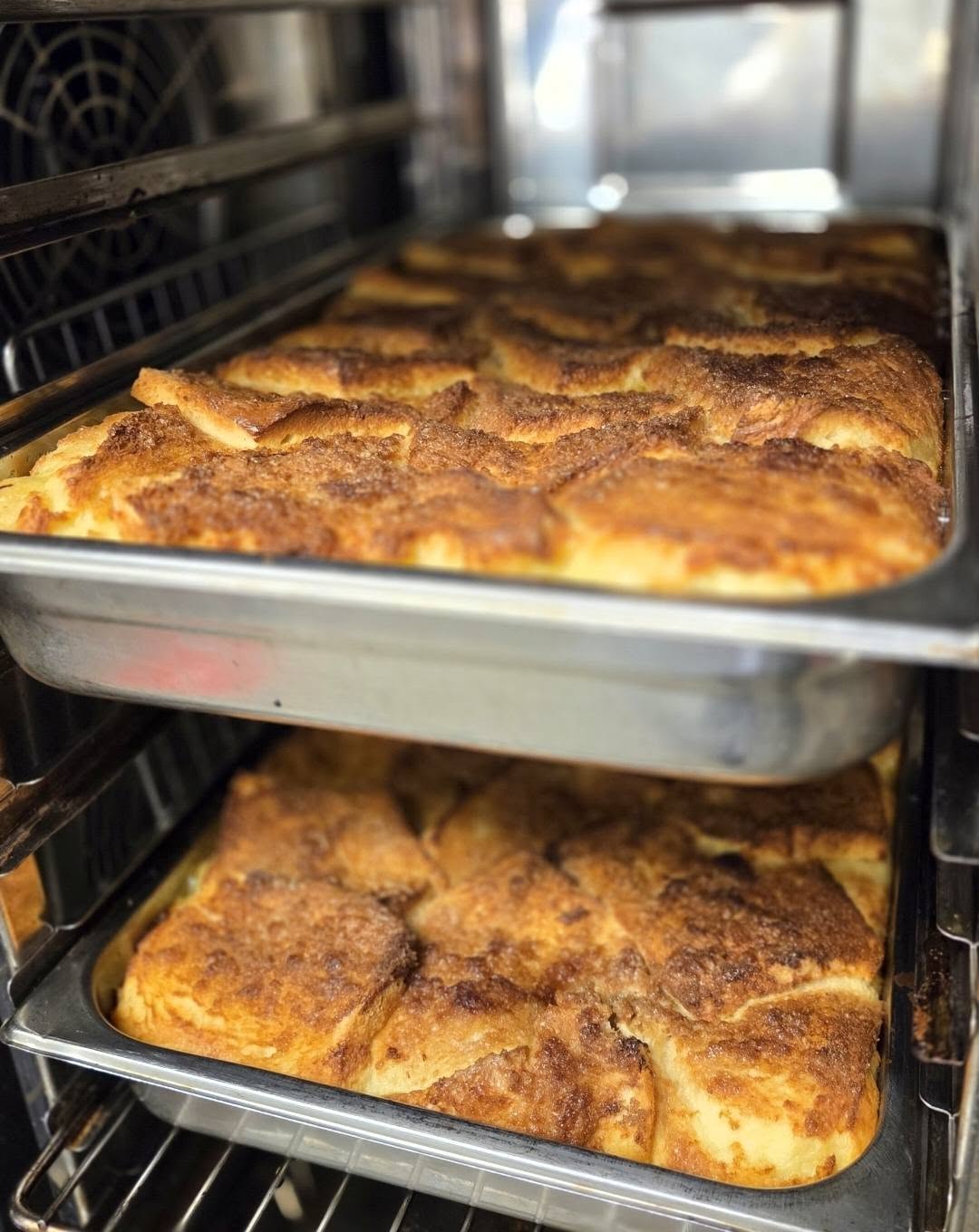 Trays of bread and butter pudding fresh from the oven